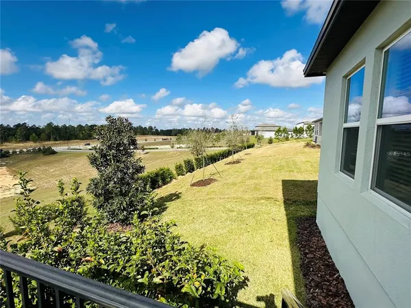 a view of a lake with houses in the back