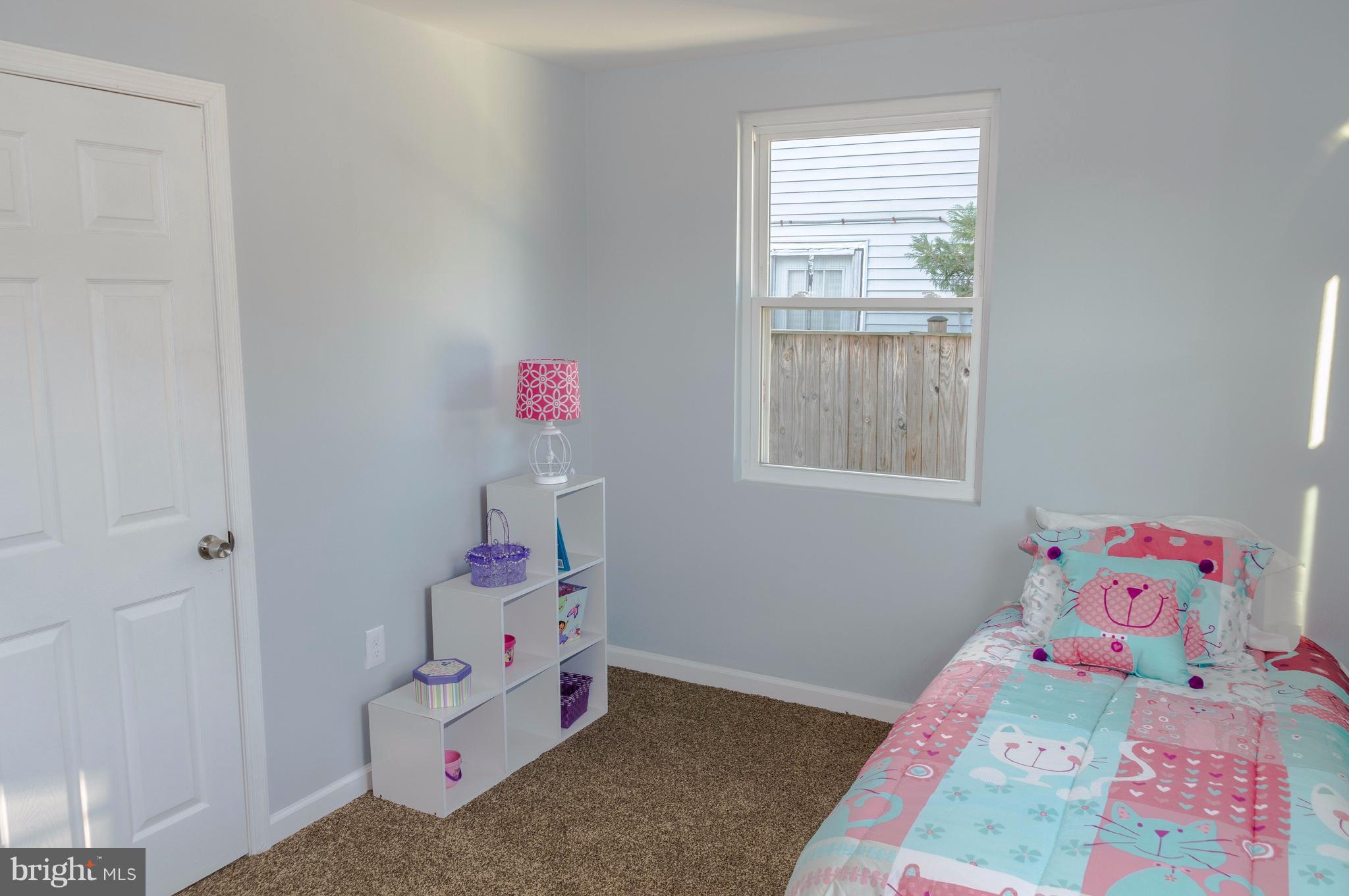 8116 Cornwall Road Baltimore, MD 21222 - Photo 14 of 22 a room with toys and a window