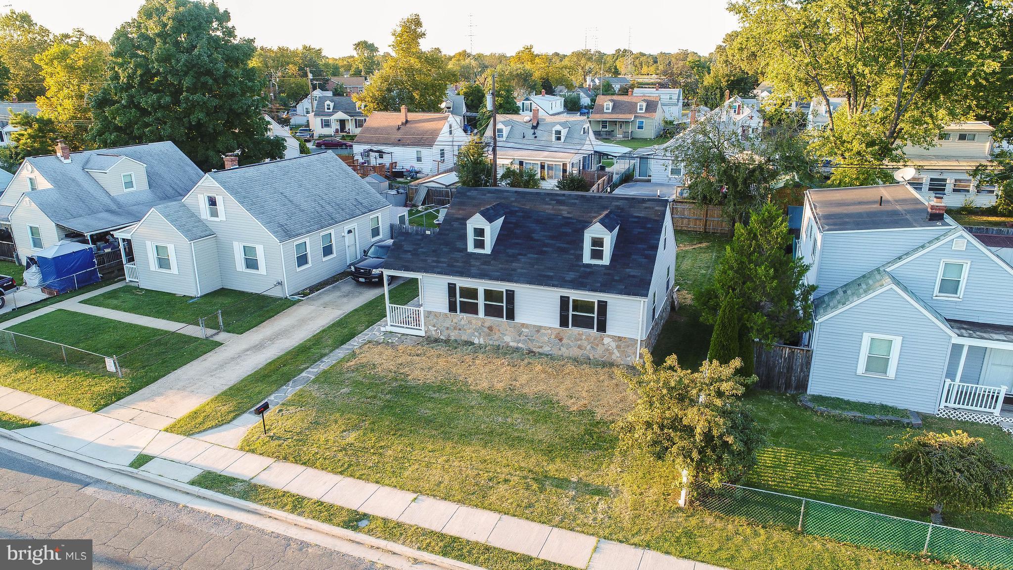8116 Cornwall Road Baltimore, MD 21222 - Photo 22 of 22 a aerial view of a house next to a big yard and large trees
