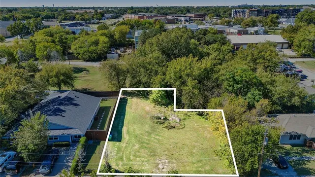 an aerial view of house with yard