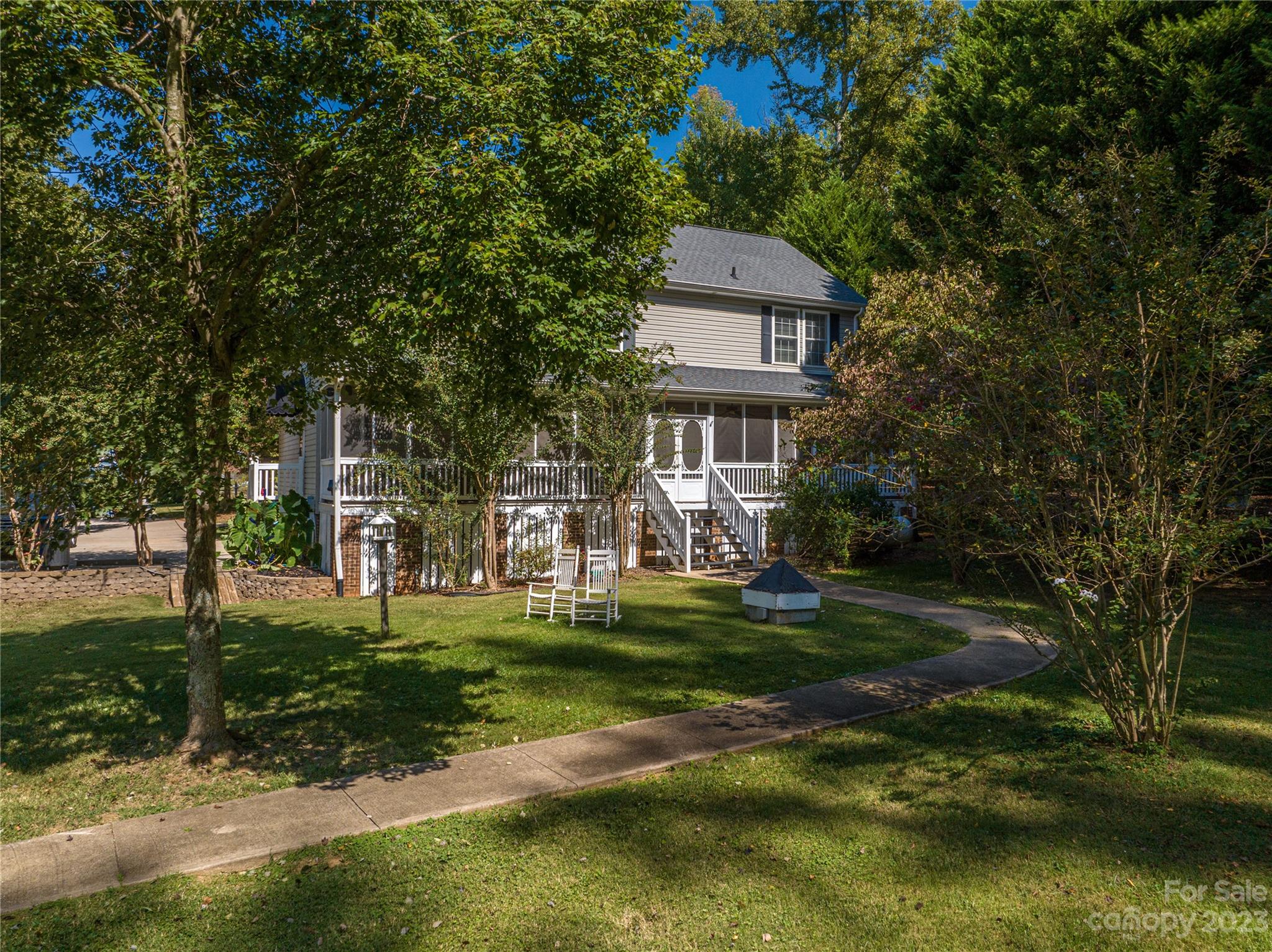 1575 Lewis Farm Road Kings Mountain, NC 28086 - Photo 23 of 42 a front view of a house with a garden