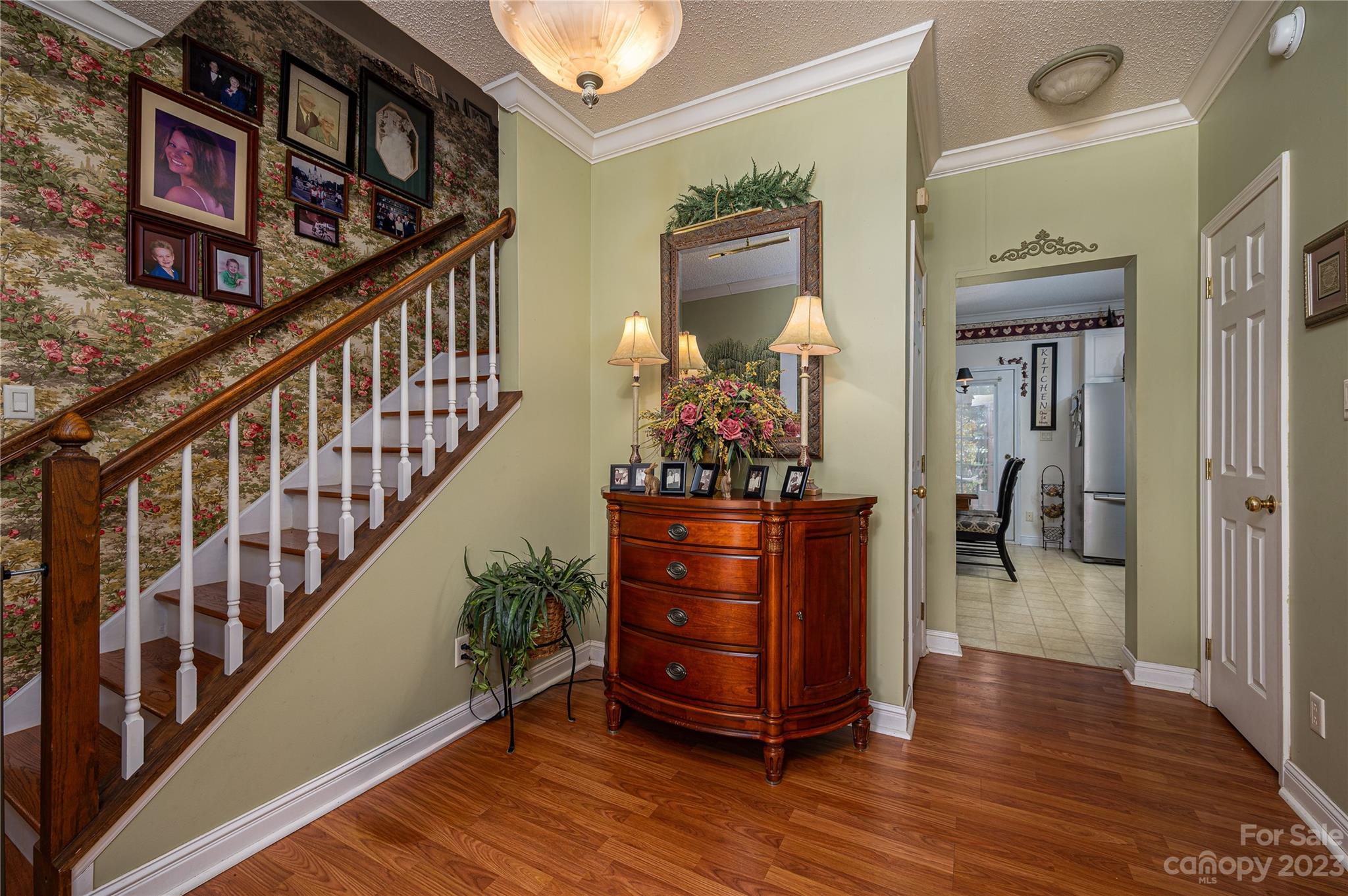 1575 Lewis Farm Road Kings Mountain, NC 28086 - Photo 3 of 42 a view of a hallway with wooden floor and staircase