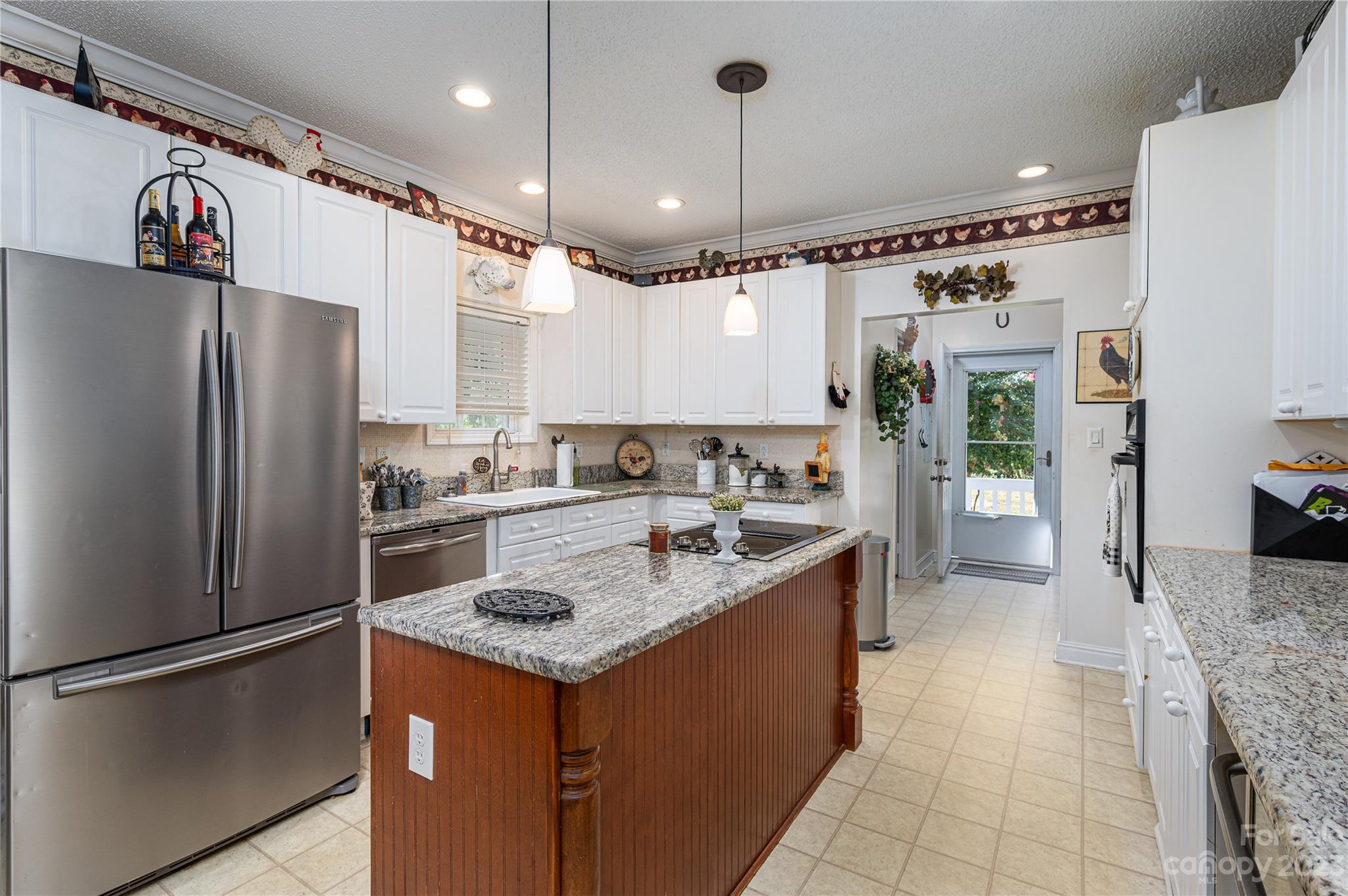 1575 Lewis Farm Road Kings Mountain, NC 28086 - Photo 6 of 42 a kitchen with stainless steel appliances granite countertop a refrigerator a sink and a stove
