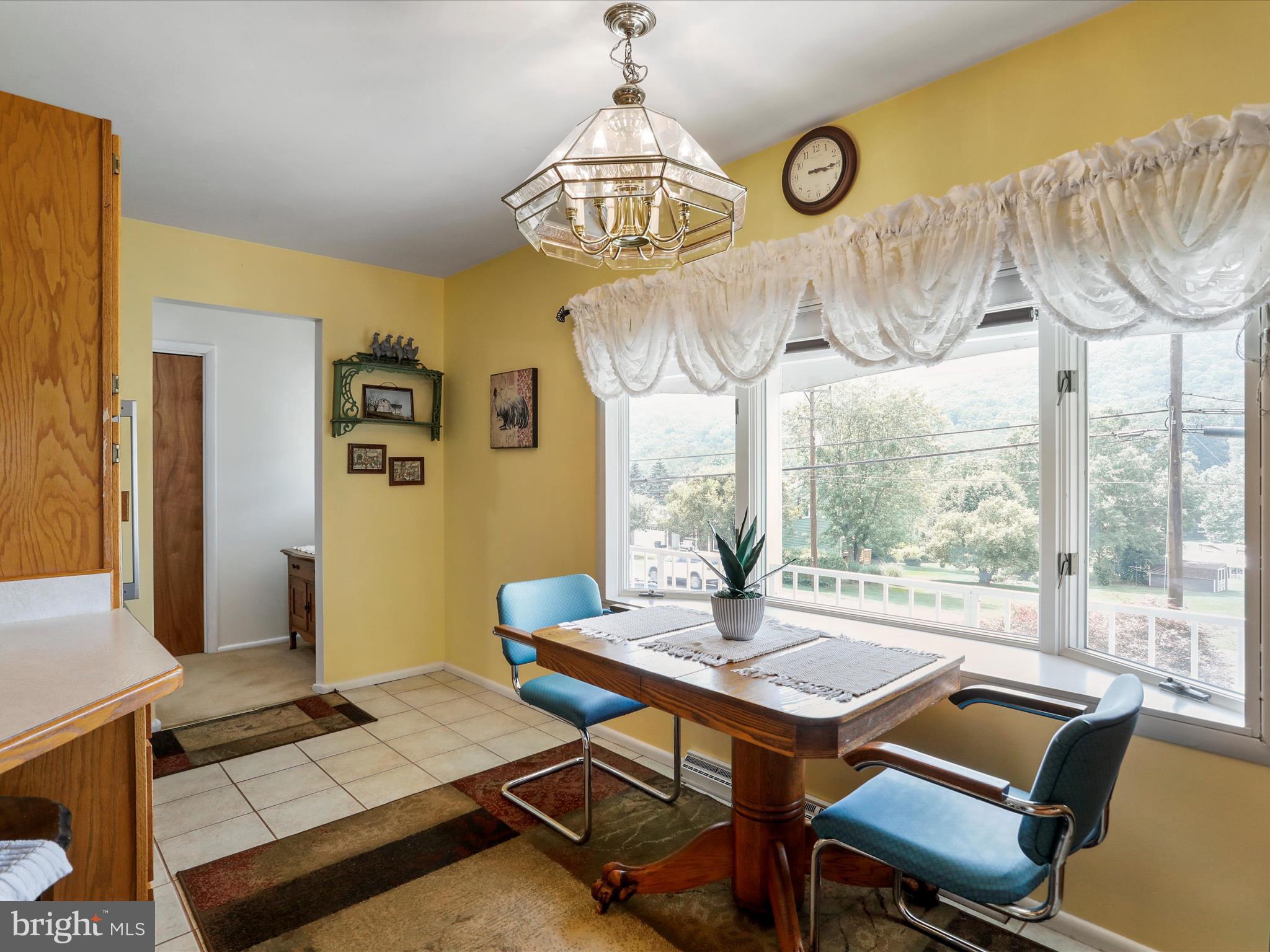 10908 Cash Valley Road Northwest La Vale, MD 21502 - Photo 8 of 34 L-shaped eat-in kitchen with exit to carport...