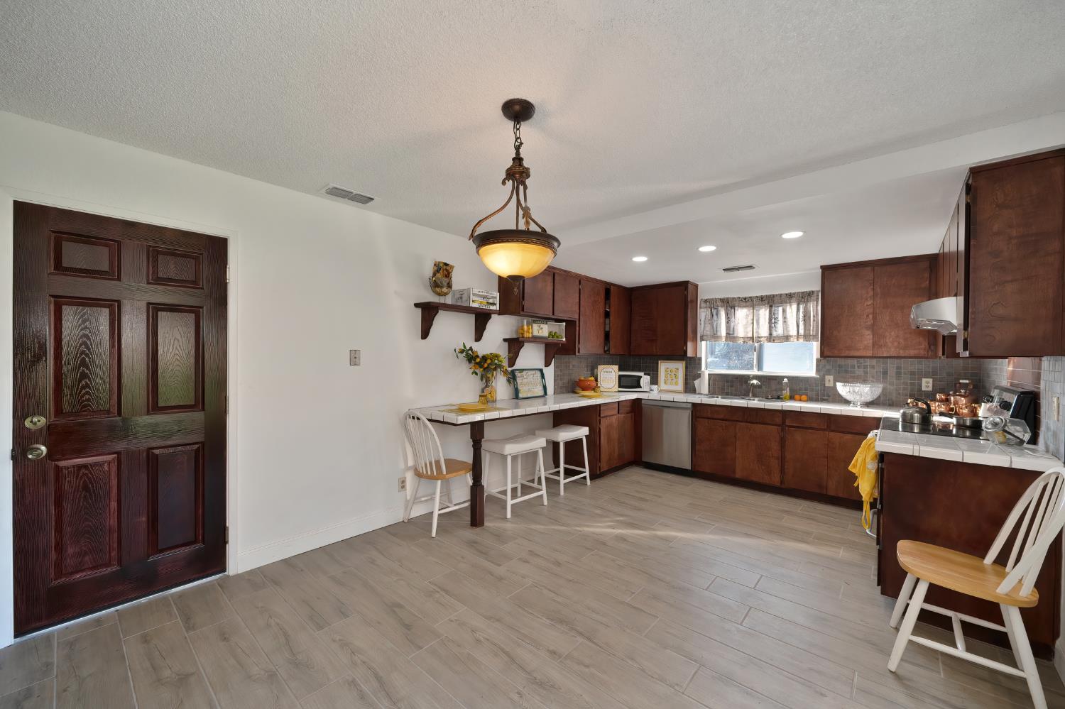 4271 Soledad Avenue Sacramento, CA 95820 - Photo 13 of 36 a kitchen with a sink cabinets and wooden floor