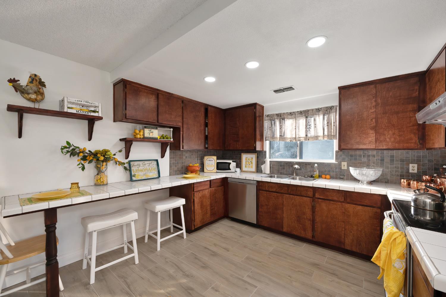 4271 Soledad Avenue Sacramento, CA 95820 - Photo 14 of 36 a kitchen with sink cabinets and wooden floor