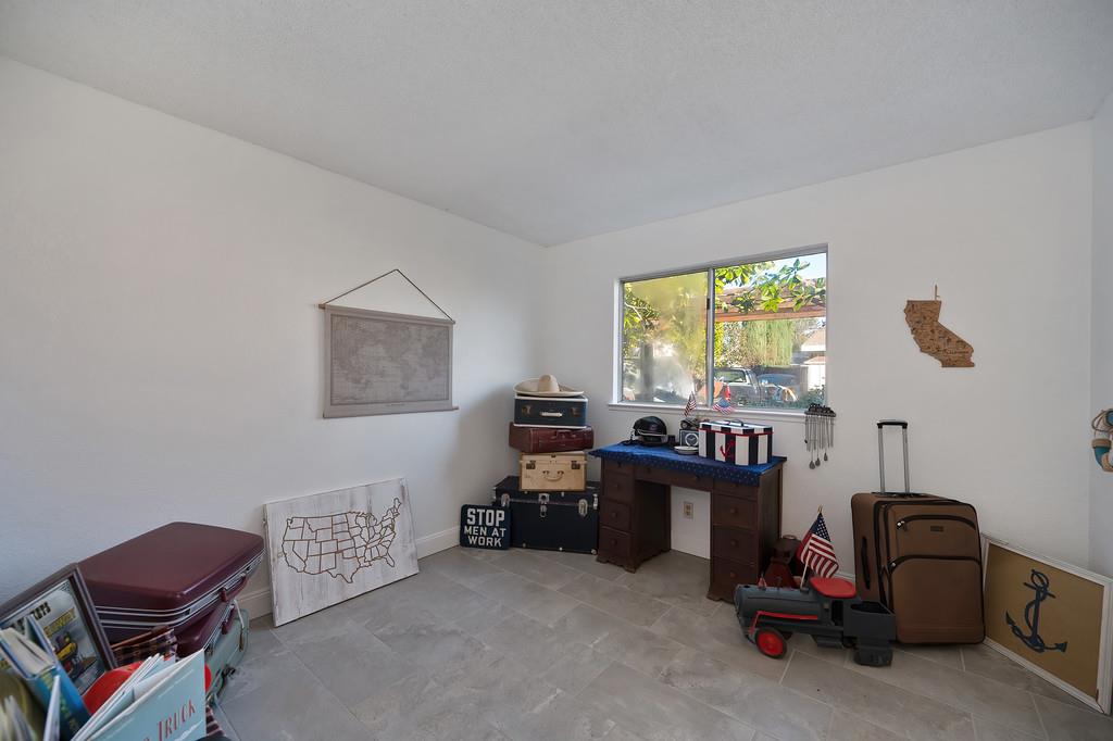 4271 Soledad Avenue Sacramento, CA 95820 - Photo 20 of 36 a view of a workspace with furniture and a window