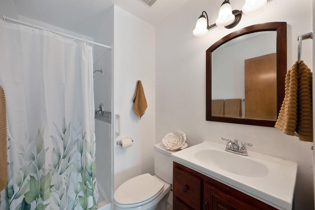 4271 Soledad Avenue Sacramento, CA 95820 - Photo 22 of 36 a bathroom with a sink a toilet and shower