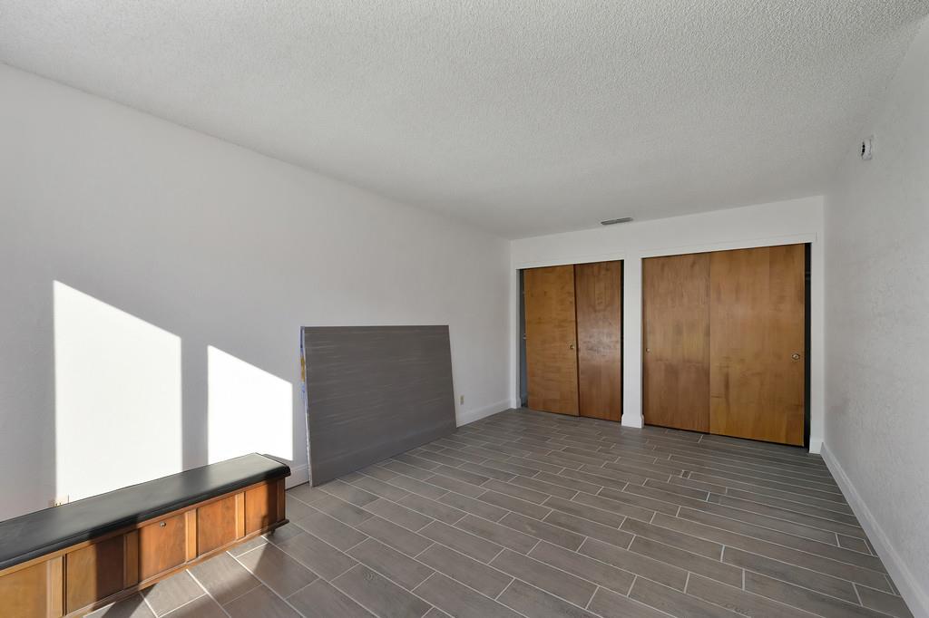 4271 Soledad Avenue Sacramento, CA 95820 - Photo 23 of 36 a view of empty room with wooden floor