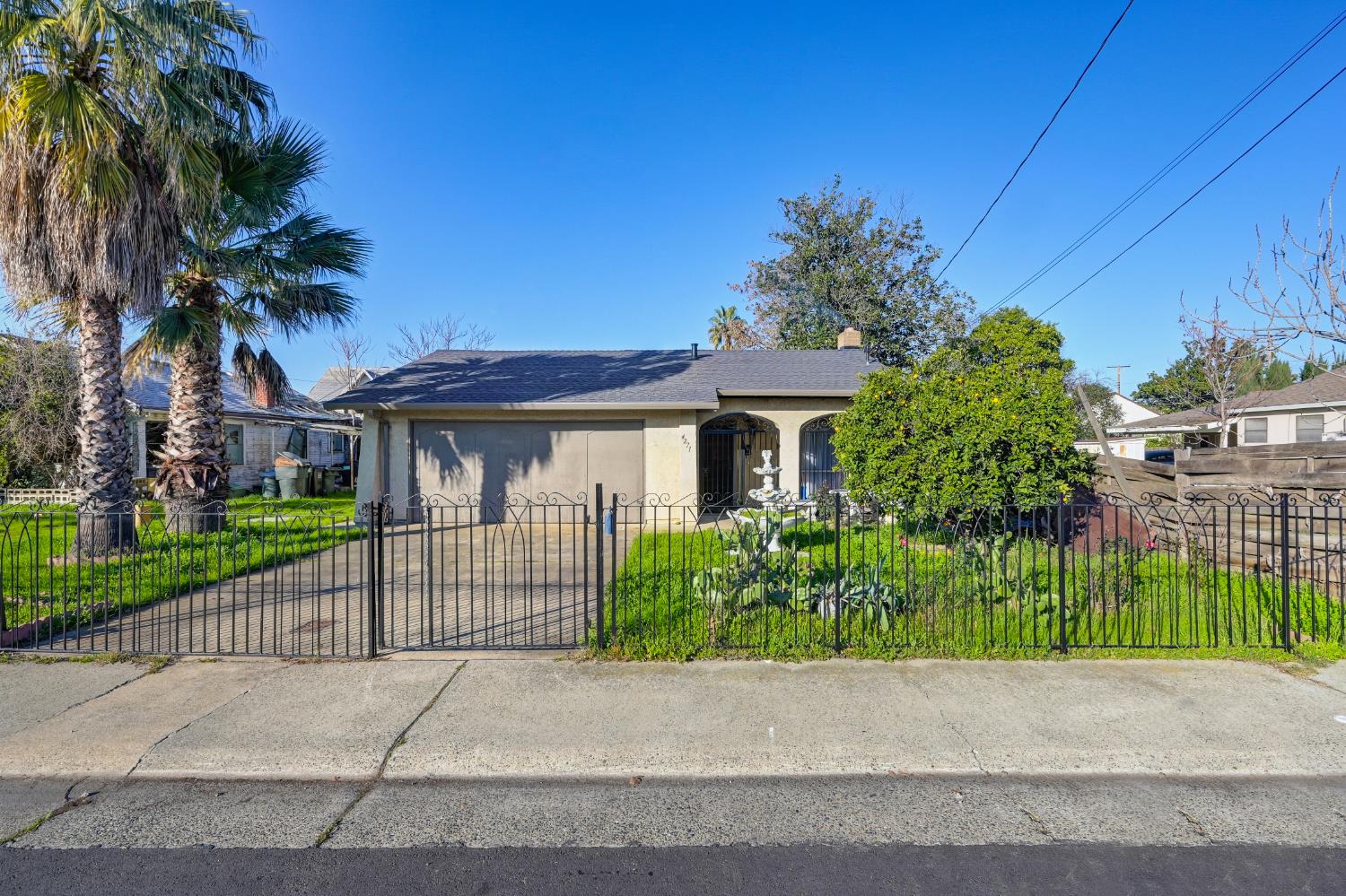 4271 Soledad Avenue Sacramento, CA 95820 - Photo 3 of 36 a front view of a house with a garden