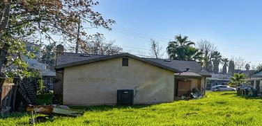 4271 Soledad Avenue Sacramento, CA 95820 - Photo 35 of 36 a backyard of a house with lots of plants and trees