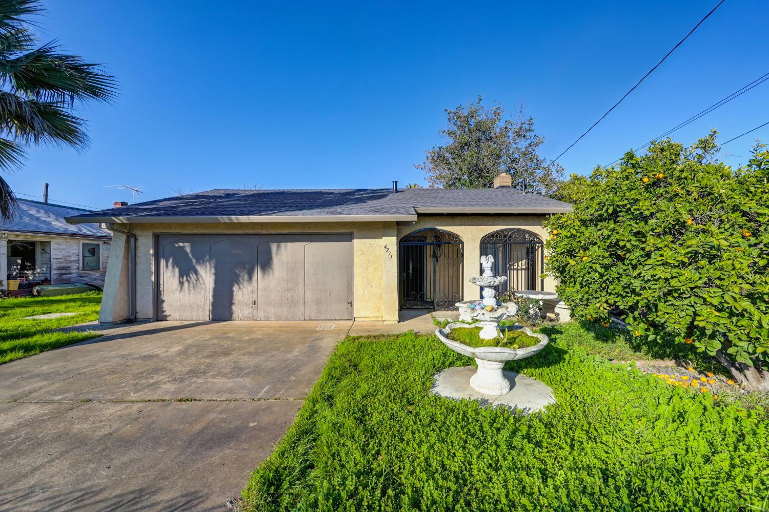 4271 Soledad Avenue Sacramento, CA 95820 - Photo 4 of 36 a front view of a house with garden