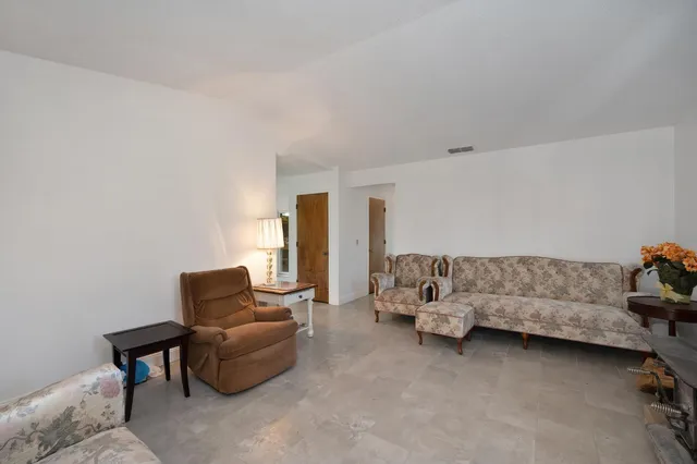 a living room with furniture and a couch