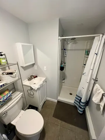 a bathroom with a toilet sink and tub