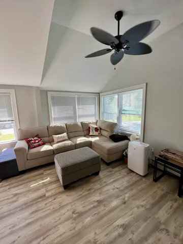 a living room with furniture and a window
