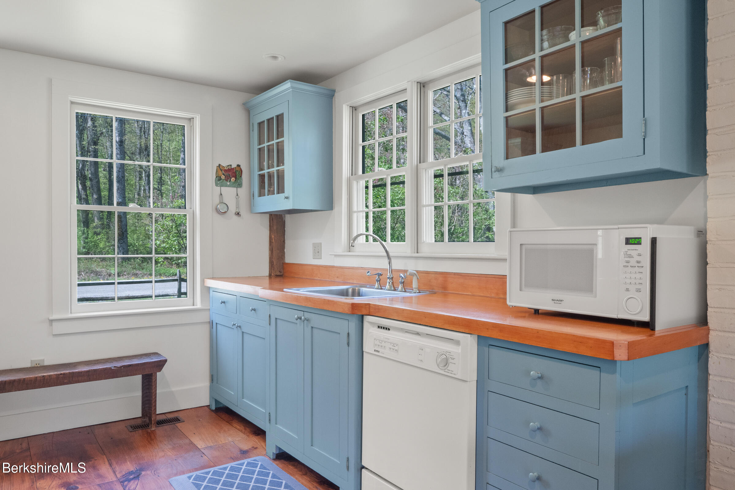 350 Beartown Mountain Road Monterey, MA 01245 - Photo 12 of 38 a kitchen with a sink and cabinets