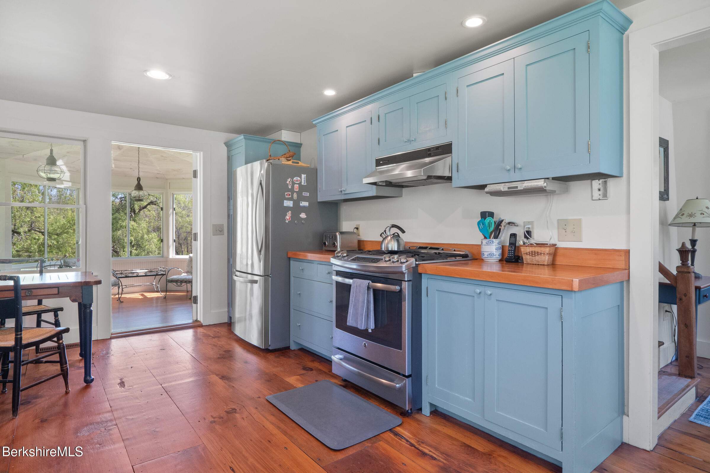 350 Beartown Mountain Road Monterey, MA 01245 - Photo 14 of 38 a kitchen with stainless steel appliances granite countertop a refrigerator sink and microwave