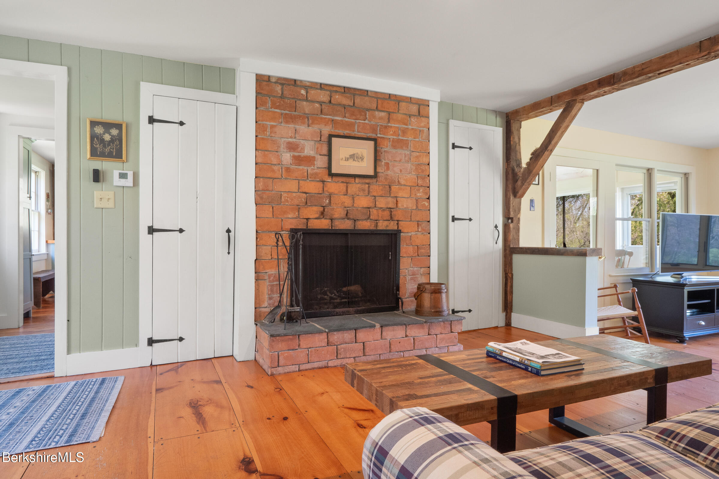 350 Beartown Mountain Road Monterey, MA 01245 - Photo 19 of 38 a bedroom with furniture and a fireplace