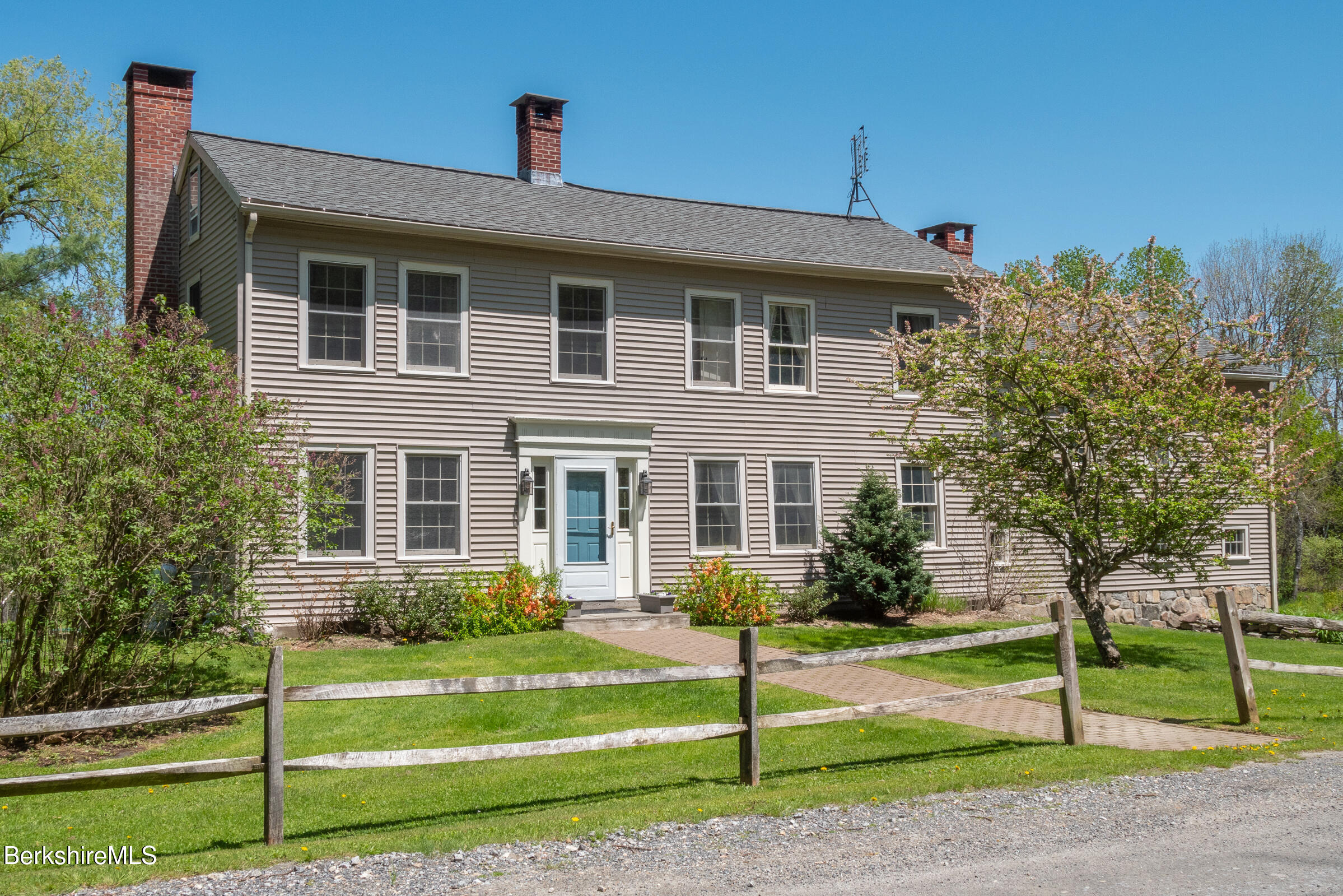 350 Beartown Mountain Road Monterey, MA 01245 - Photo 2 of 38 a front view of a house with a yard
