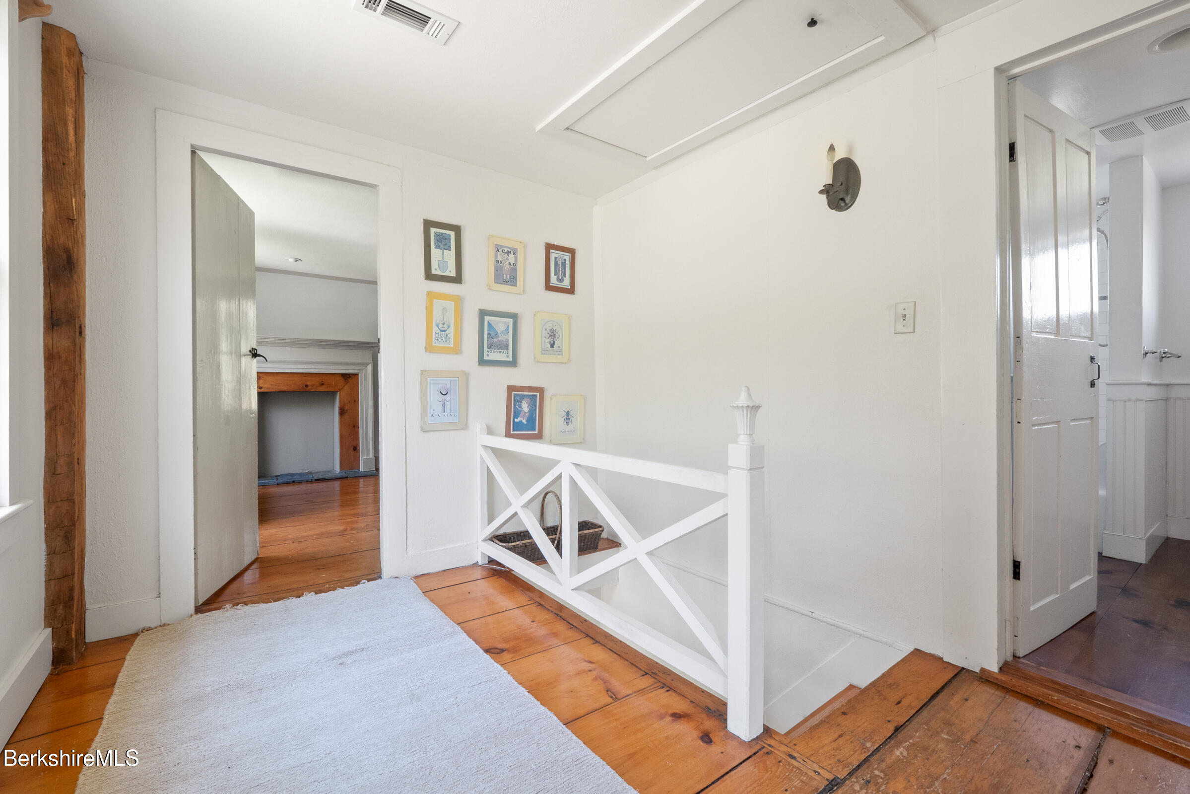350 Beartown Mountain Road Monterey, MA 01245 - Photo 25 of 38 a view of a livingroom with wooden floor and a ceiling fan