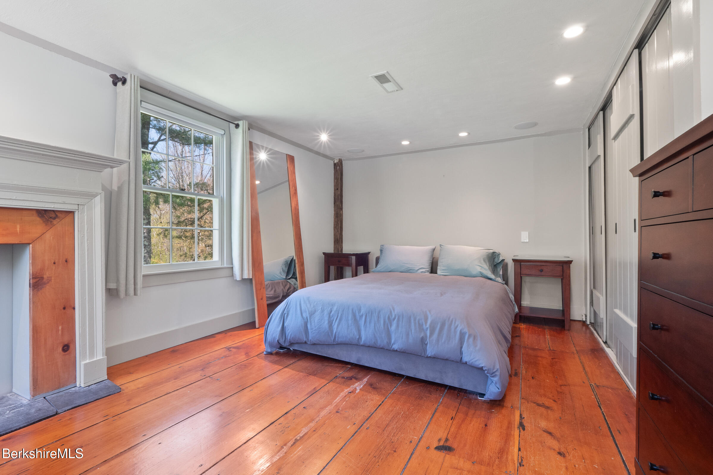 350 Beartown Mountain Road Monterey, MA 01245 - Photo 32 of 38 a bedroom with a large bed and a window