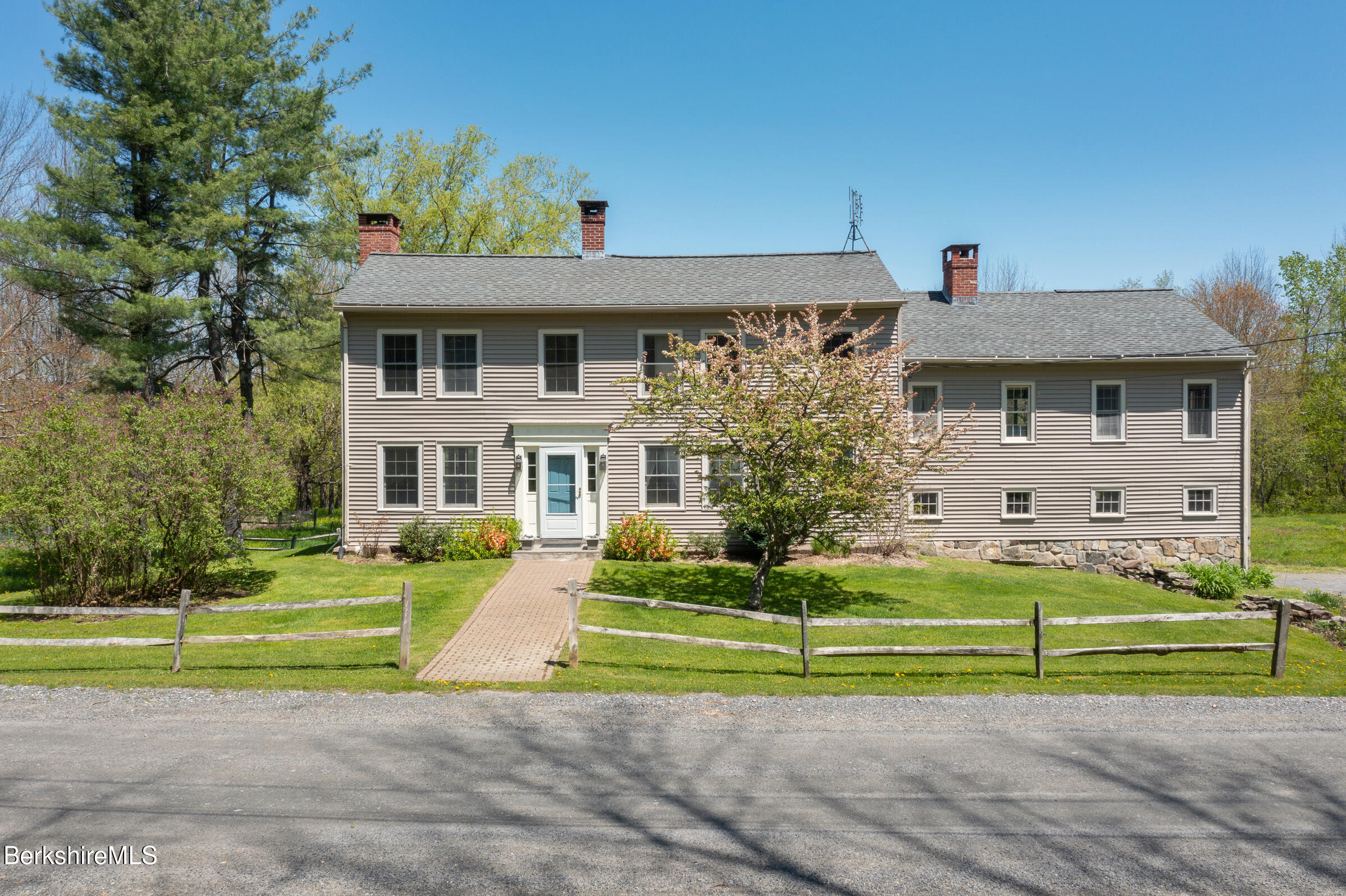 350 Beartown Mountain Road Monterey, MA 01245 - Photo 36 of 38 a front view of a house with a yard