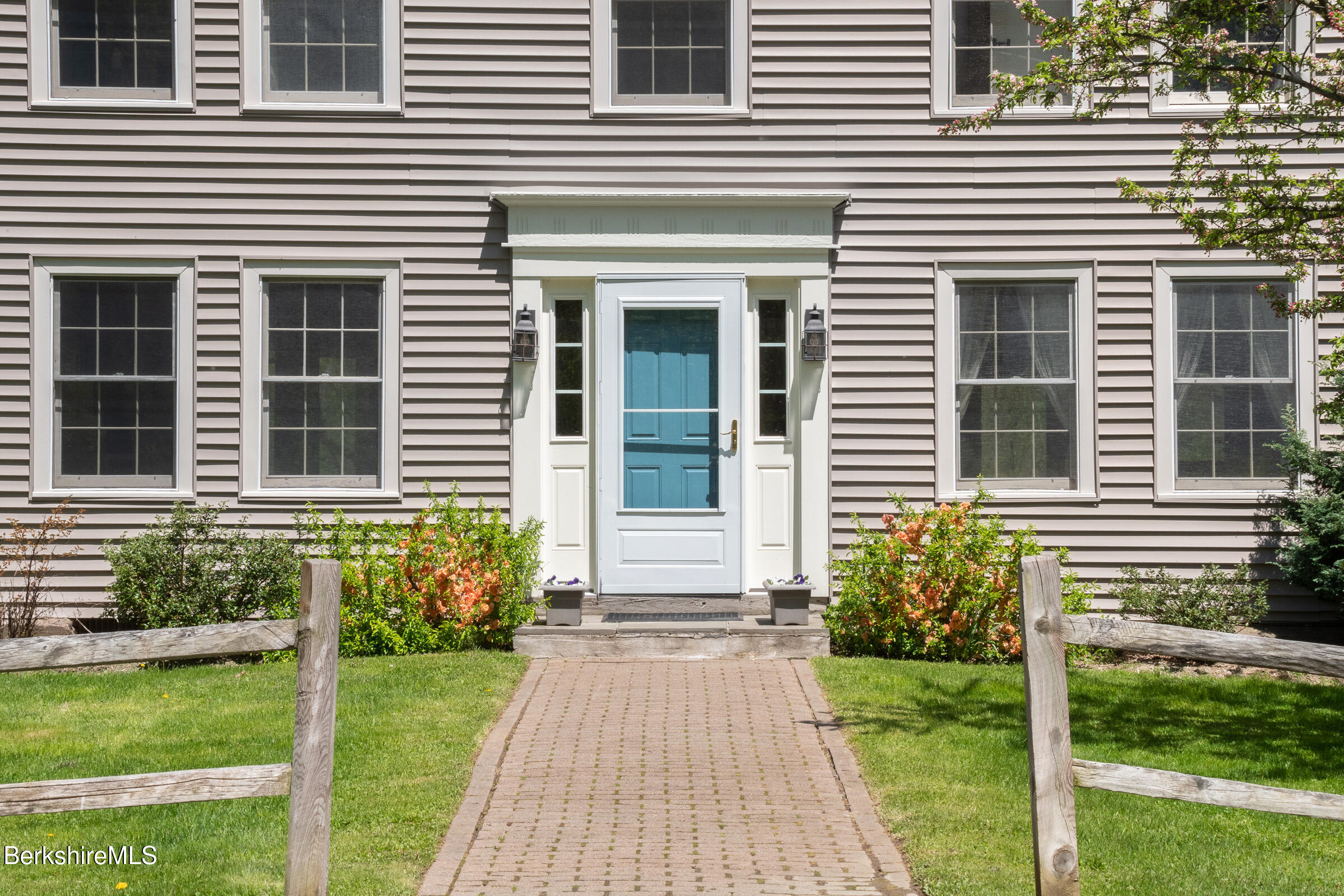 350 Beartown Mountain Road Monterey, MA 01245 - Photo 9 of 38 a front view of a house with a yard