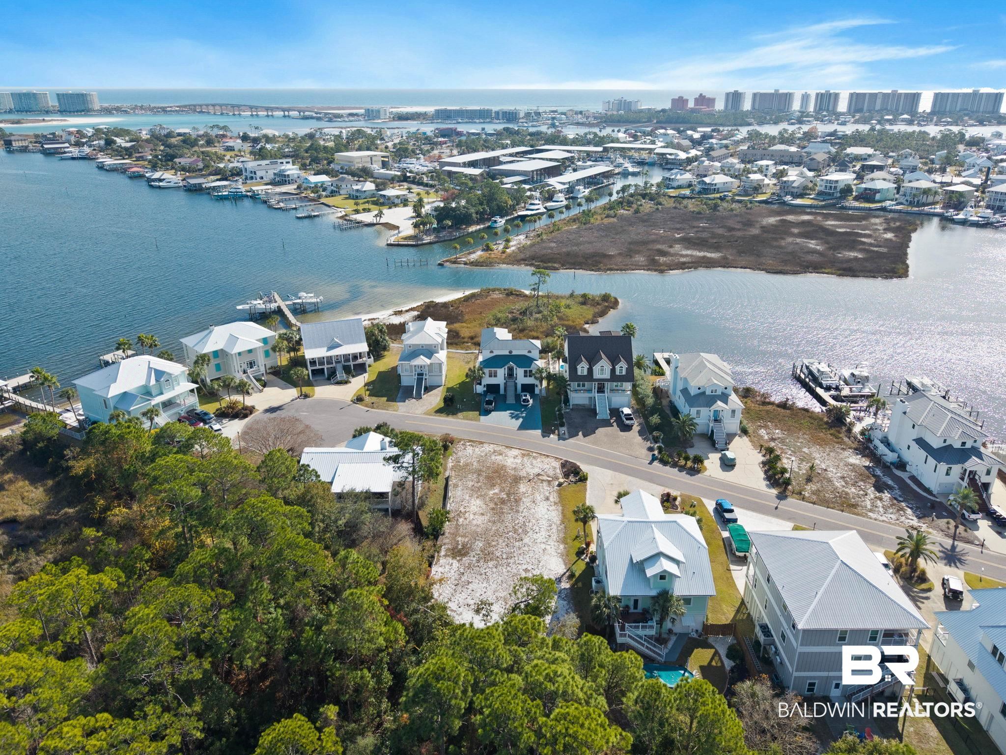 4143 Harbor Road Orange Beach, AL 36561 - Photo 20 of 33 Aerial view of residential area with a nearby body of water