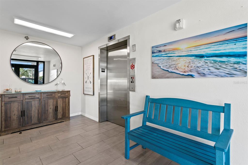 16332 Gulf Boulevard, Unit 3B Redington Beach, FL 33708 - Photo 50 of 91 a kitchen with a refrigerator and a sink