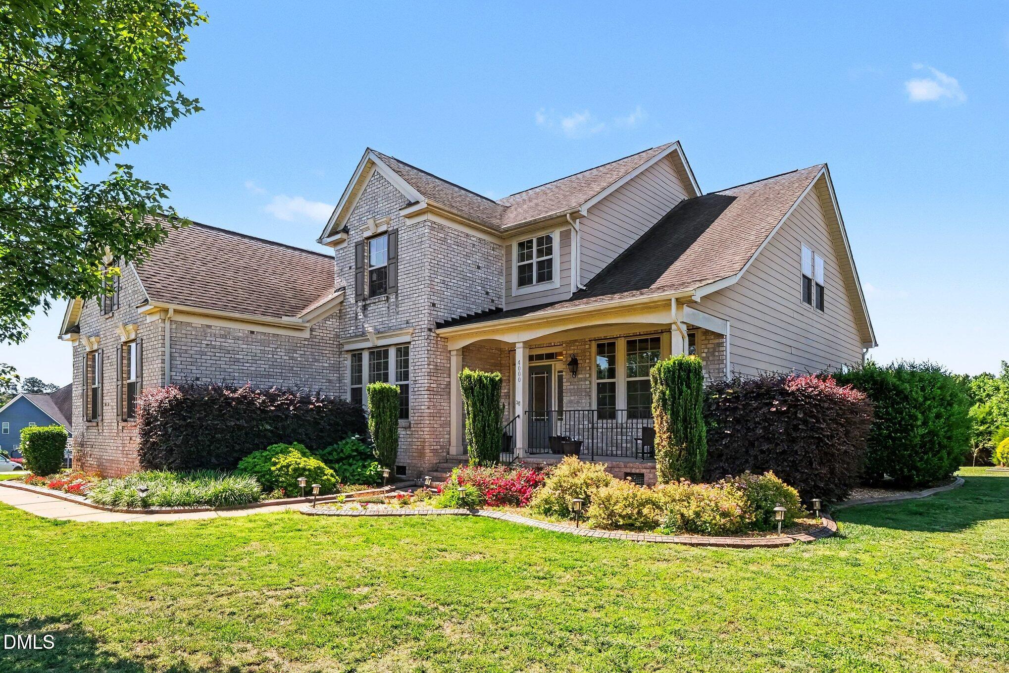 4000 Banks Stone Drive Raleigh, NC 27603 - Photo 57 of 60 a front view of house and yard with green space