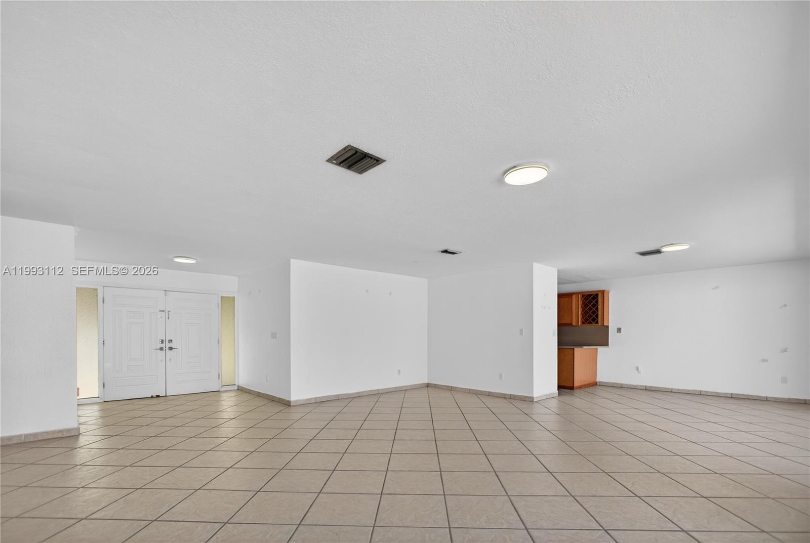 13471 Southwest 99th Terrace Miami, FL 33186 - Photo 36 of 44 an empty room with natural light and window