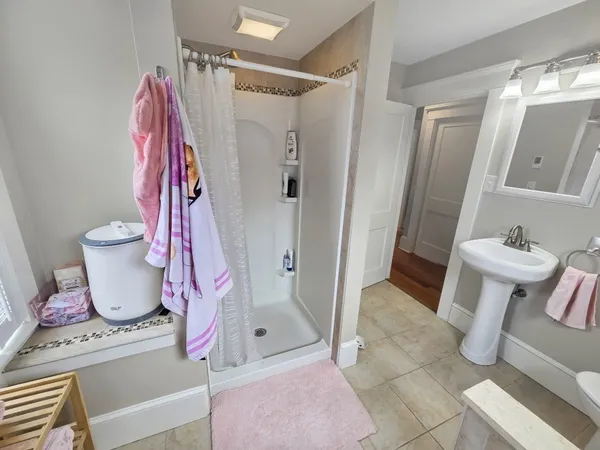 a bathroom with a sink and toilet