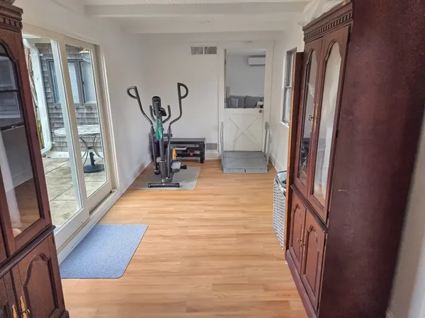 a view of a hallway with furniture and front door