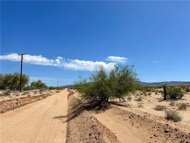 a view of a yard with a snow on the road