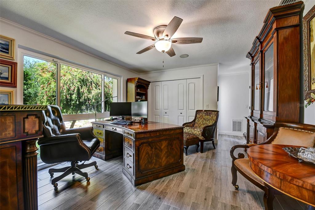 1875 Belleair Road Clearwater, FL 33764 - Photo 29 of 100 a view of a workspace with furniture and a window