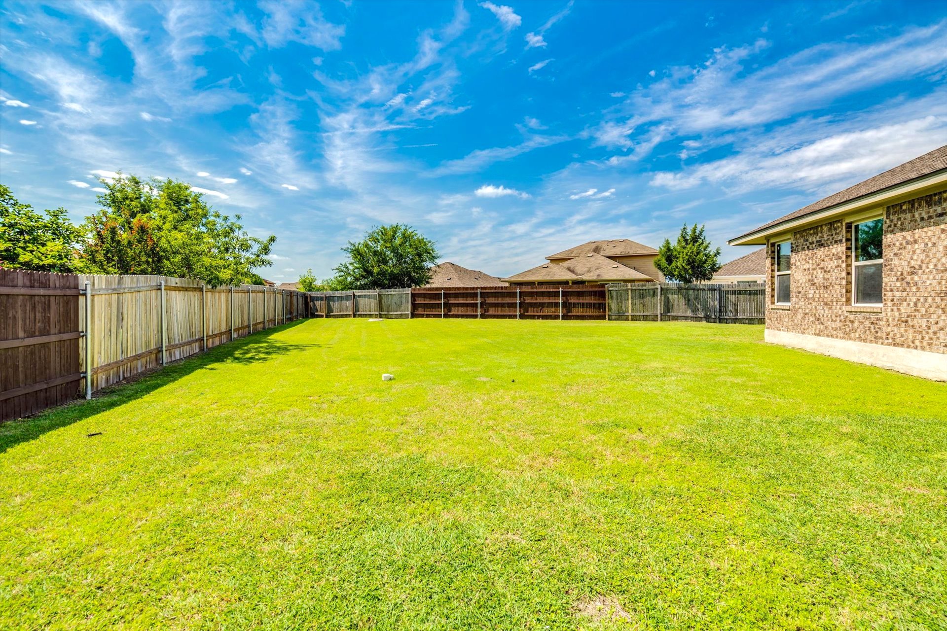 16829 Ruggio Road Pflugerville, TX 78660 - Photo 30 of 40 a view of swimming pool with an outdoor space and seating area