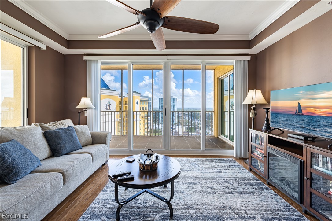 2743 First Street, Unit 2206 Fort Myers, FL 33916 - Photo 11 of 38 a living room with furniture and a fireplace