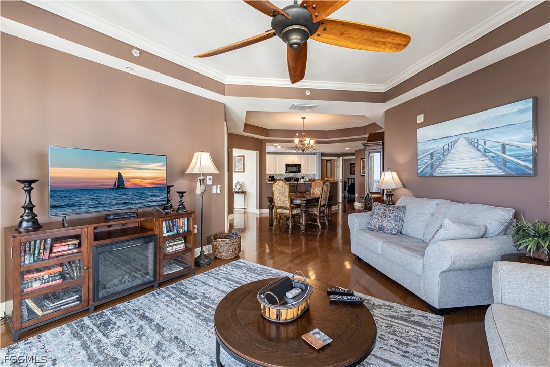 2743 First Street, Unit 2206 Fort Myers, FL 33916 - Photo 12 of 38 a living room with furniture and a flat screen tv