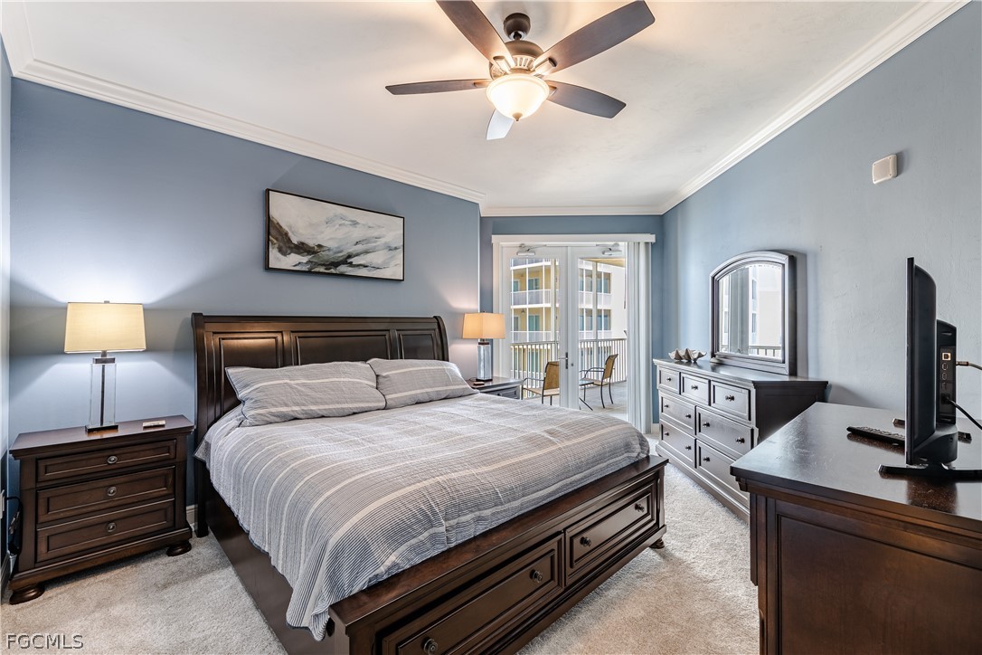 2743 First Street, Unit 2206 Fort Myers, FL 33916 - Photo 18 of 38 a bedroom with a bed and a flat screen tv
