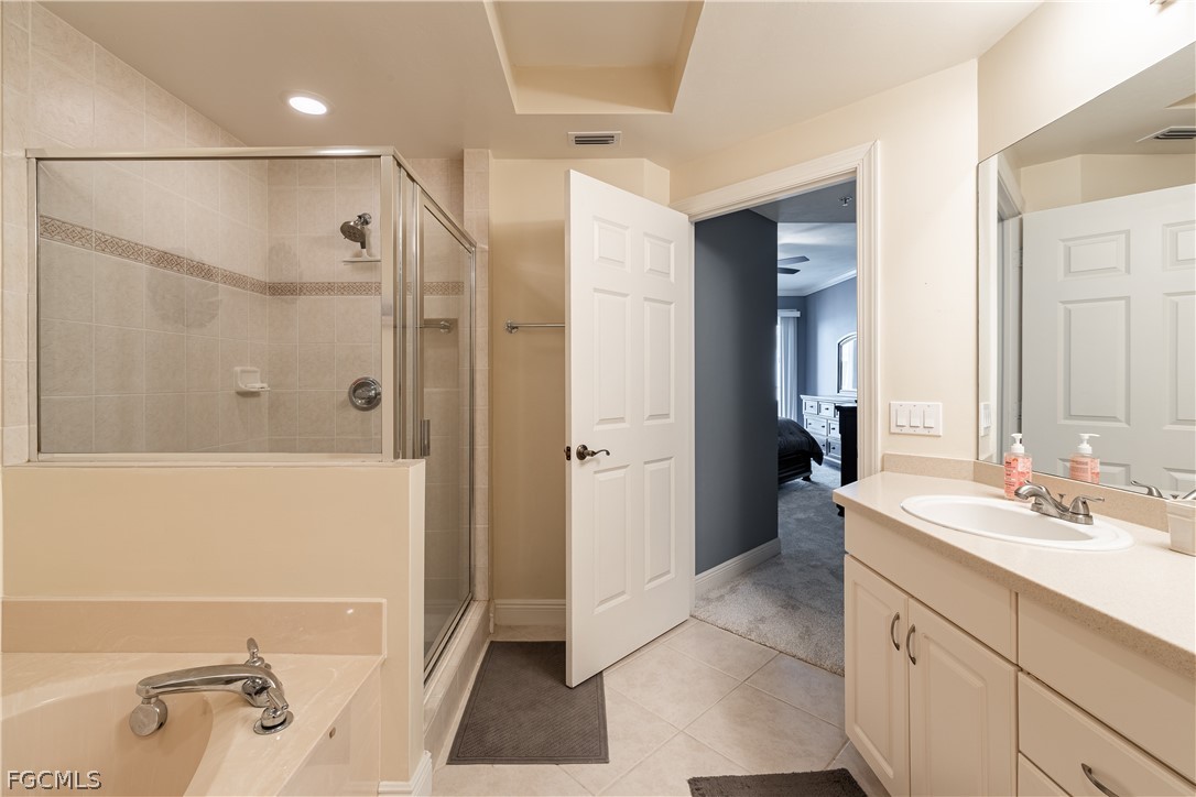 2743 First Street, Unit 2206 Fort Myers, FL 33916 - Photo 20 of 38 a bathroom with a tub sink and mirror