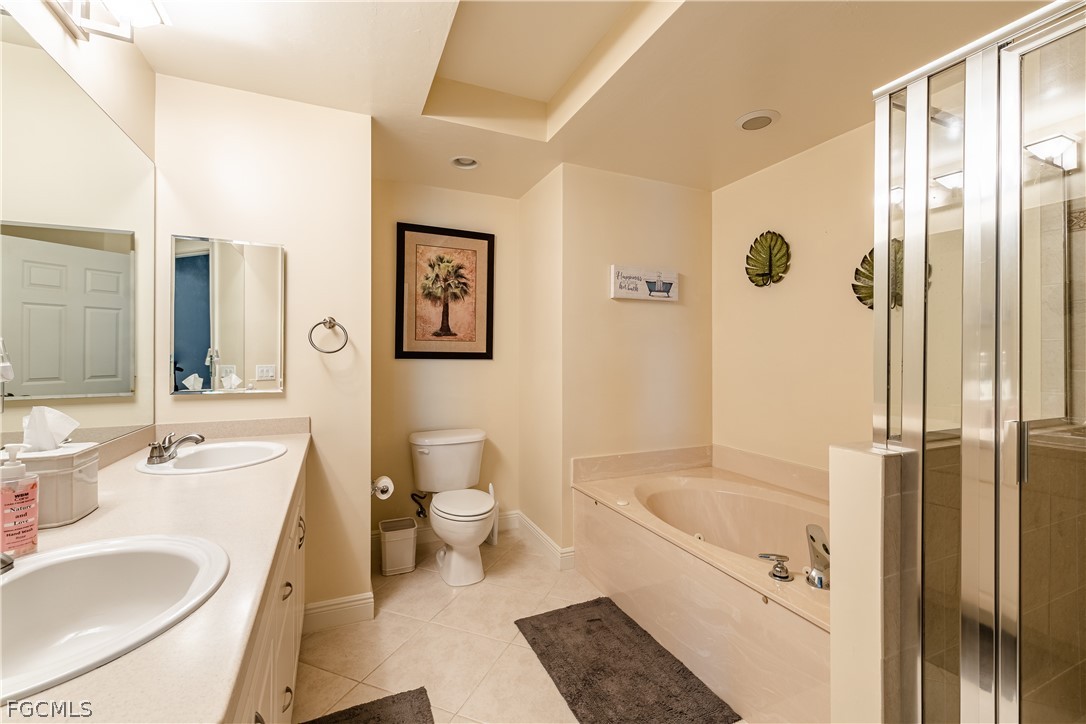 2743 First Street, Unit 2206 Fort Myers, FL 33916 - Photo 21 of 38 a bathroom with a granite countertop sink toilet and shower