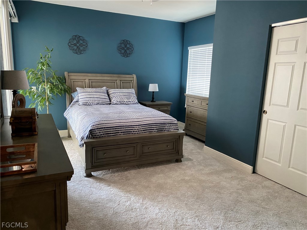 2743 First Street, Unit 2206 Fort Myers, FL 33916 - Photo 25 of 38 a bedroom with a bed and a desk