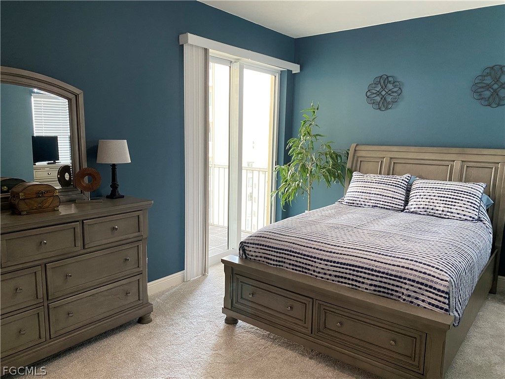 2743 First Street, Unit 2206 Fort Myers, FL 33916 - Photo 26 of 38 a bedroom with a bed and a window