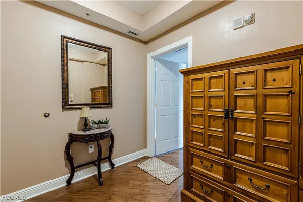 a view of an entryway with wooden floor