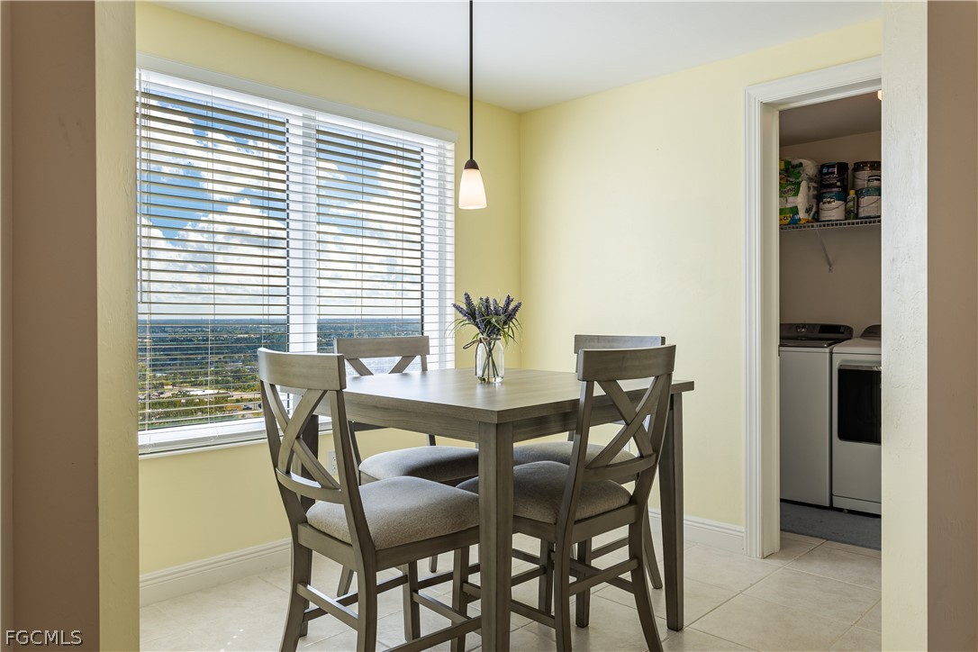 2743 First Street, Unit 2206 Fort Myers, FL 33916 - Photo 32 of 38 a dining room with furniture and window