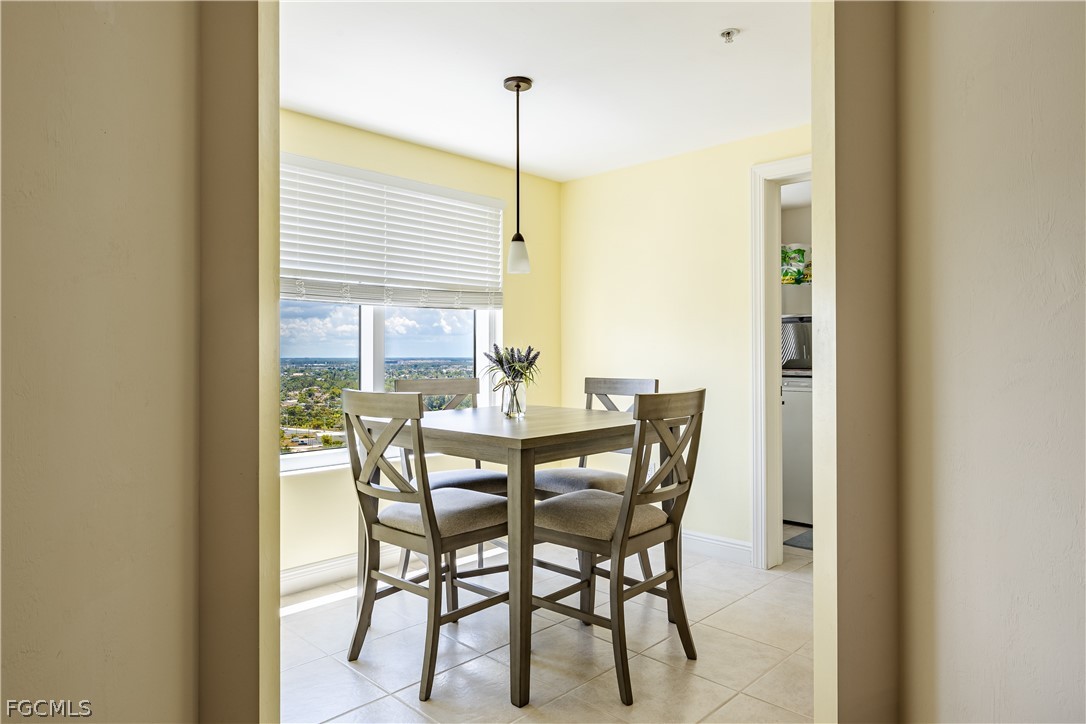 2743 First Street, Unit 2206 Fort Myers, FL 33916 - Photo 33 of 38 a view of a dining room with furniture window and outside view