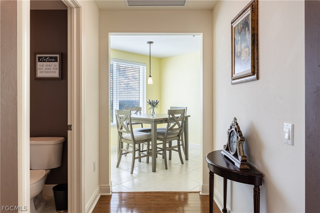 2743 First Street, Unit 2206 Fort Myers, FL 33916 - Photo 34 of 38 a view of a dining room with furniture and a potted plant