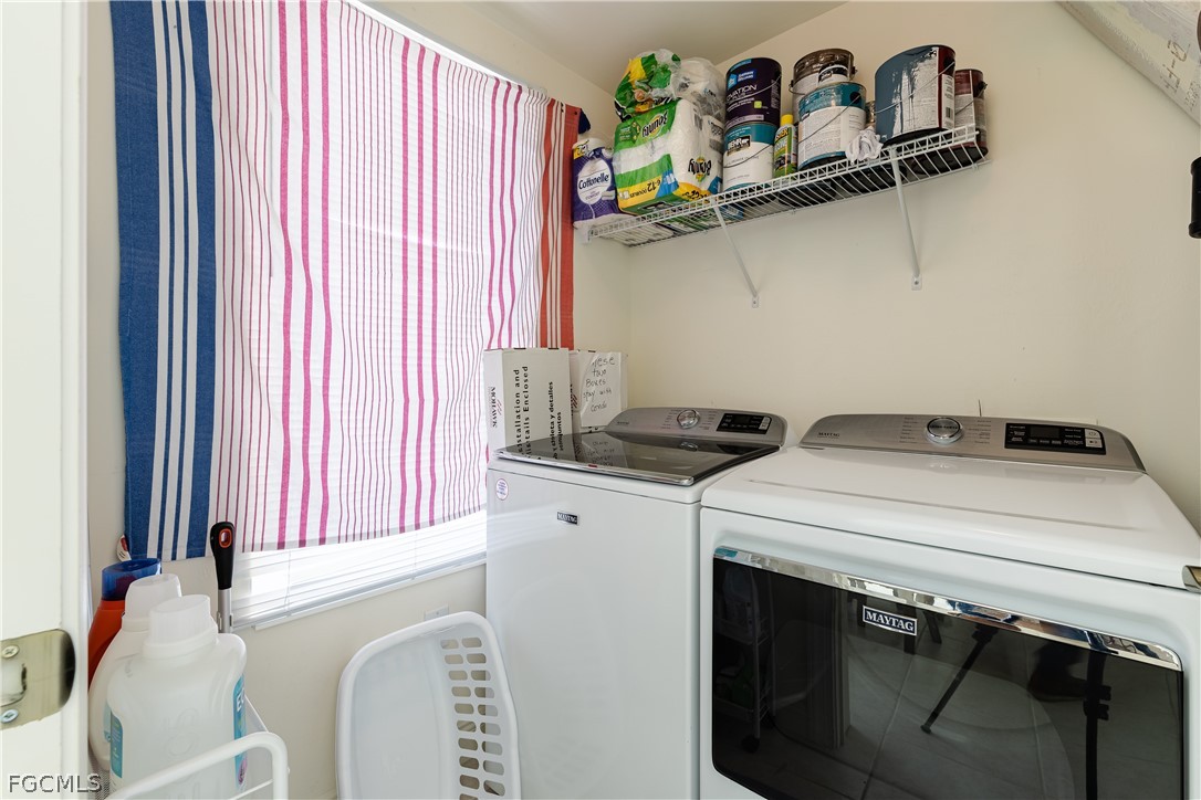 2743 First Street, Unit 2206 Fort Myers, FL 33916 - Photo 35 of 38 a utility room with dryer and washer