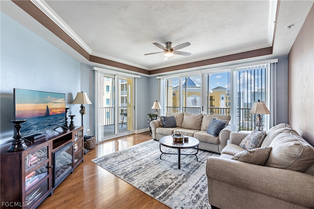 2743 First Street, Unit 2206 Fort Myers, FL 33916 - Photo 10 of 38 a living room with furniture and a flat screen tv