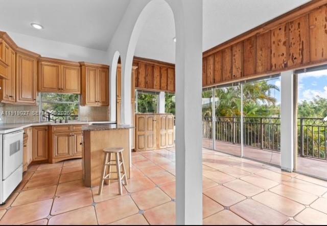 4850 Southwest 63rd Terrace, Unit 232 Davie, FL 33314 - Photo 10 of 28 a view of kitchen with furniture and large window
